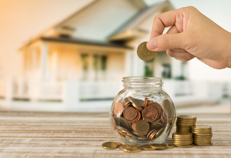 Person saving money up to purchase home