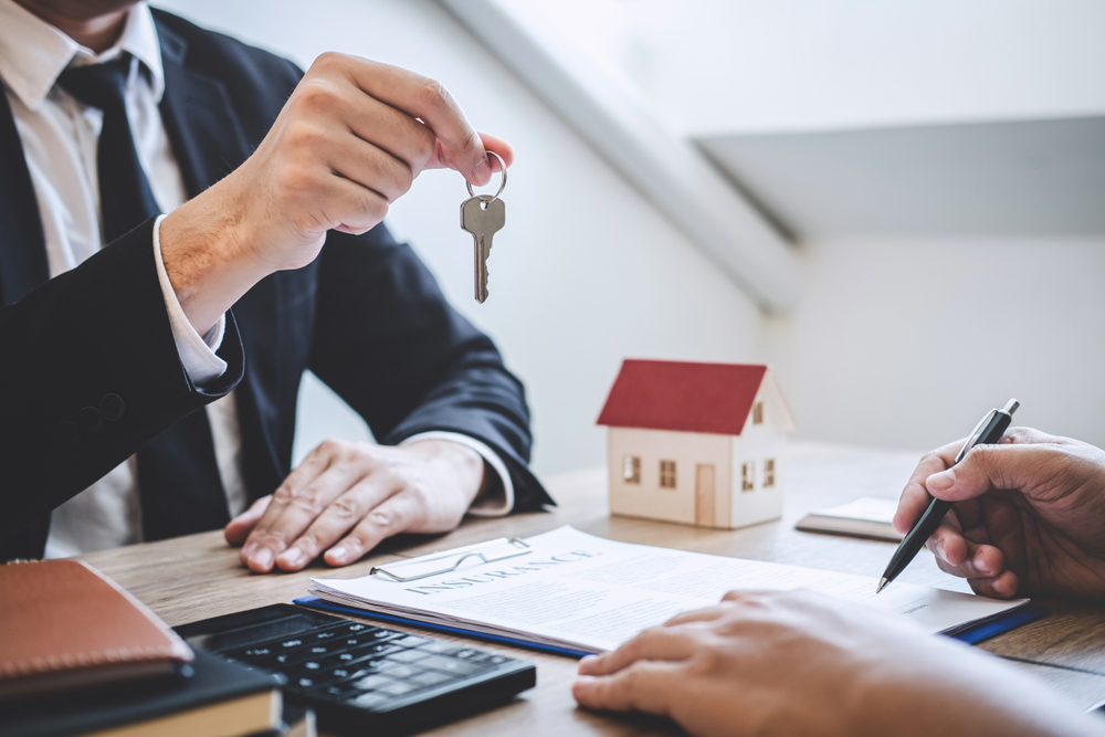 guy handing key to client