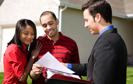 real estate agent showing papers